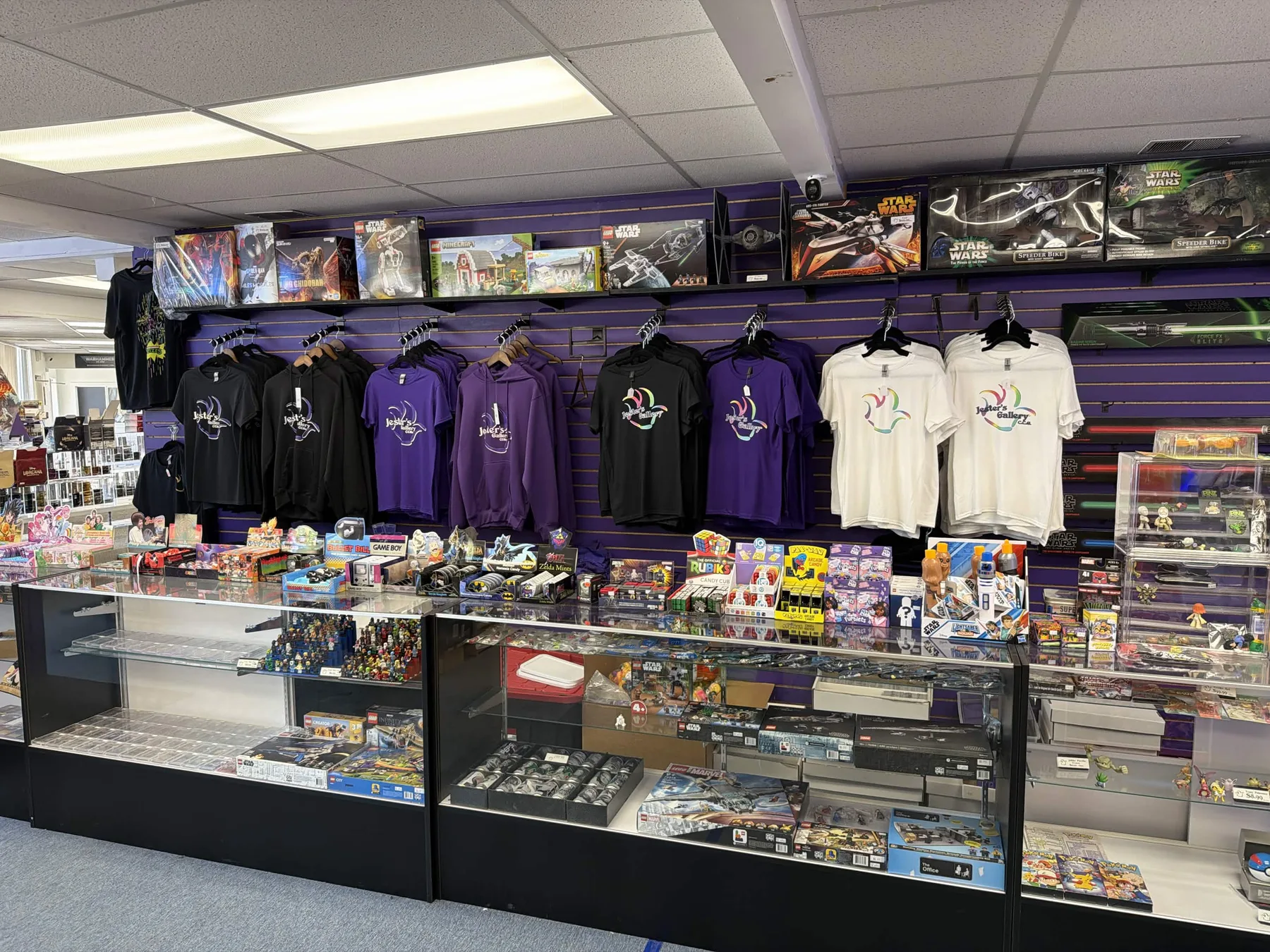 Inside Jester's Gallery — aisles, counter, and apparel